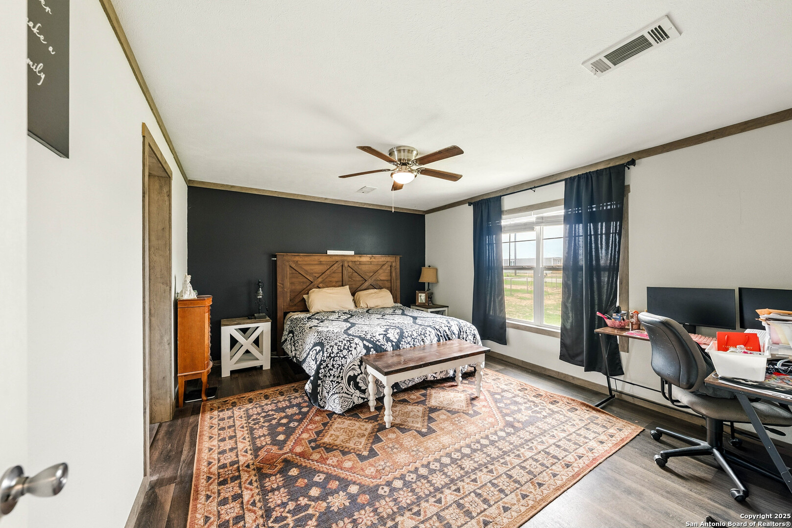 238 Las Palomas Drive Lytle, TX 78052 - Photo 10 of 25 a bedroom with furniture and a window