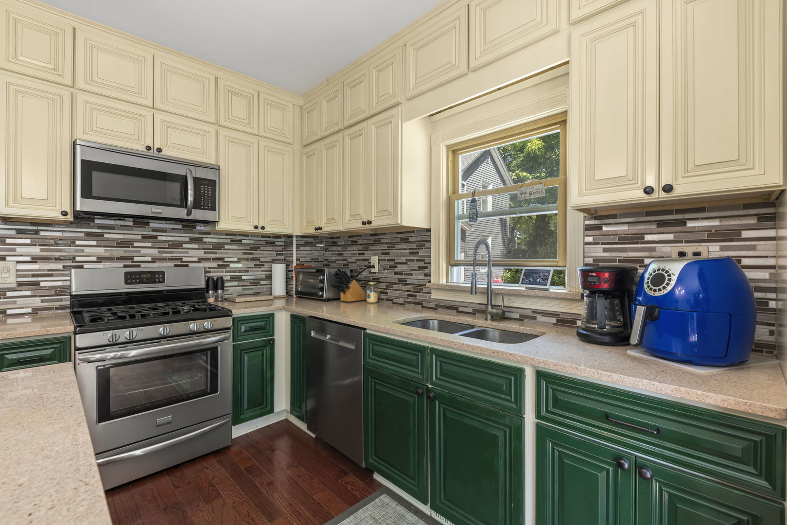520 South Jefferson Street Lockport, IL 60441 - Photo 10 of 31 a kitchen with stainless steel appliances granite countertop a stove a sink and a microwave