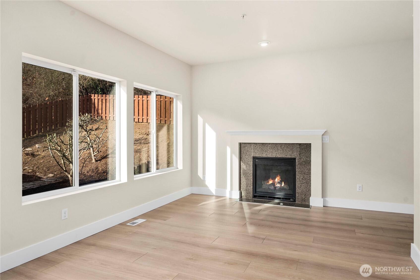 4125 South 220th Place, Unit 26 Kent, WA 98032 - Photo 13 of 39 a view of an empty room with window and fire place