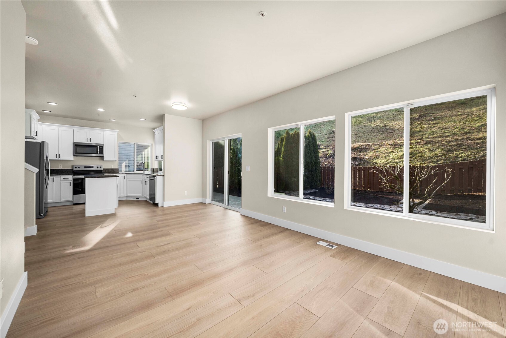 4125 South 220th Place, Unit 26 Kent, WA 98032 - Photo 14 of 39 a view of a kitchen with wooden floor and a kitchen