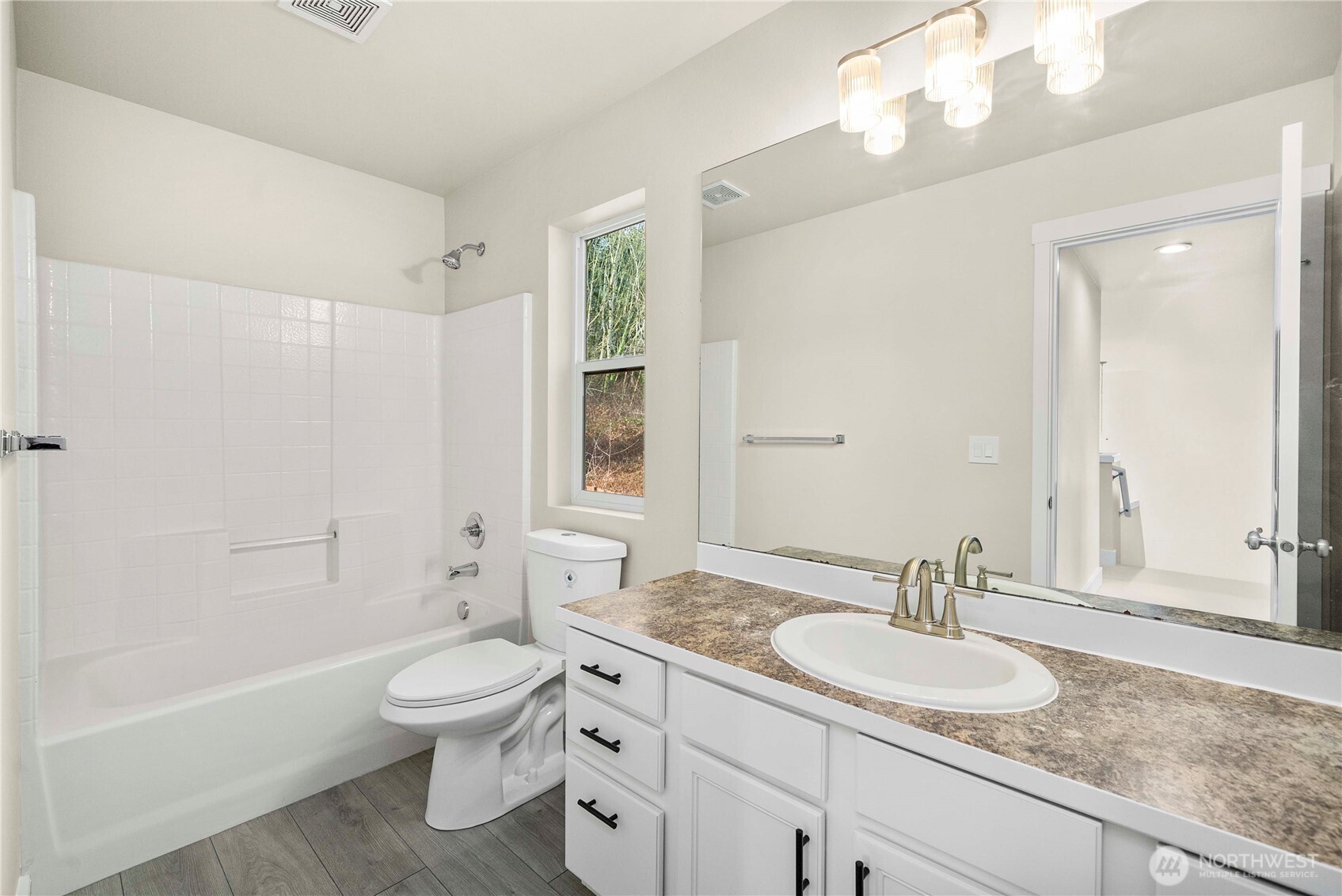 4125 South 220th Place, Unit 26 Kent, WA 98032 - Photo 19 of 39 a bathroom with a granite countertop sink a toilet and shower