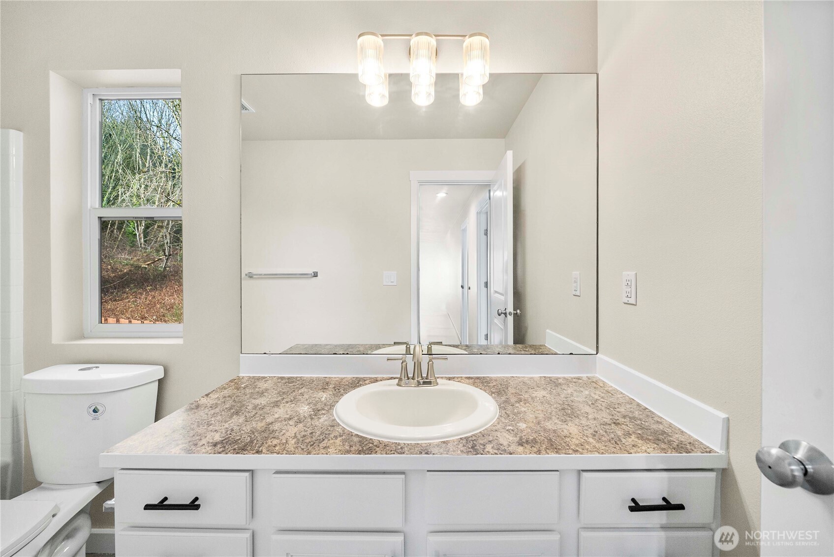 4125 South 220th Place, Unit 26 Kent, WA 98032 - Photo 20 of 39 a bathroom with a granite countertop sink and a mirror