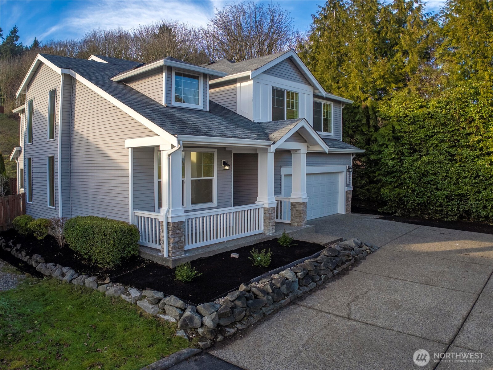 4125 South 220th Place, Unit 26 Kent, WA 98032 - Photo 2 of 39 a front view of a house with a yard