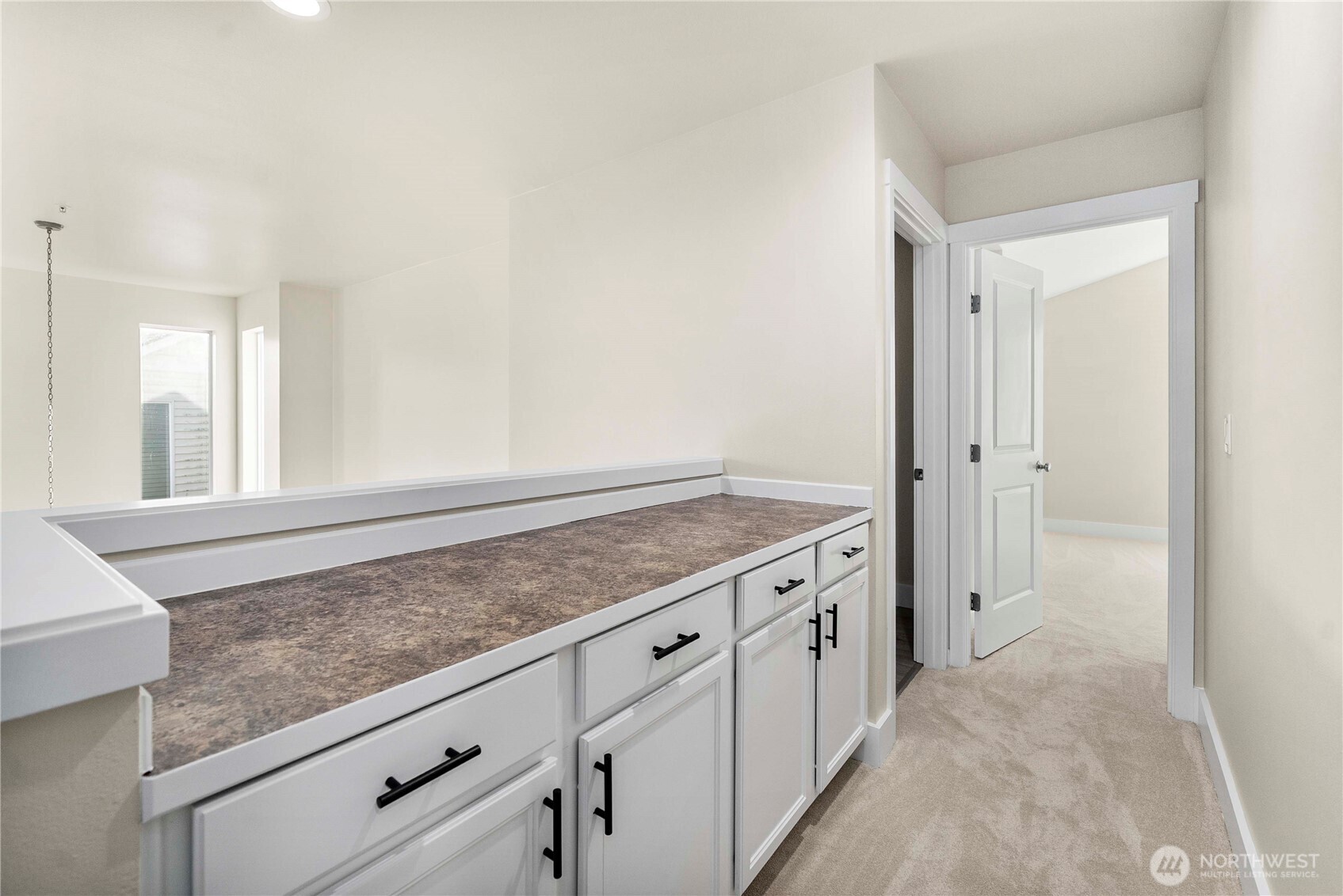 4125 South 220th Place, Unit 26 Kent, WA 98032 - Photo 24 of 39 a view of a kitchen cabinets and a wooden floor