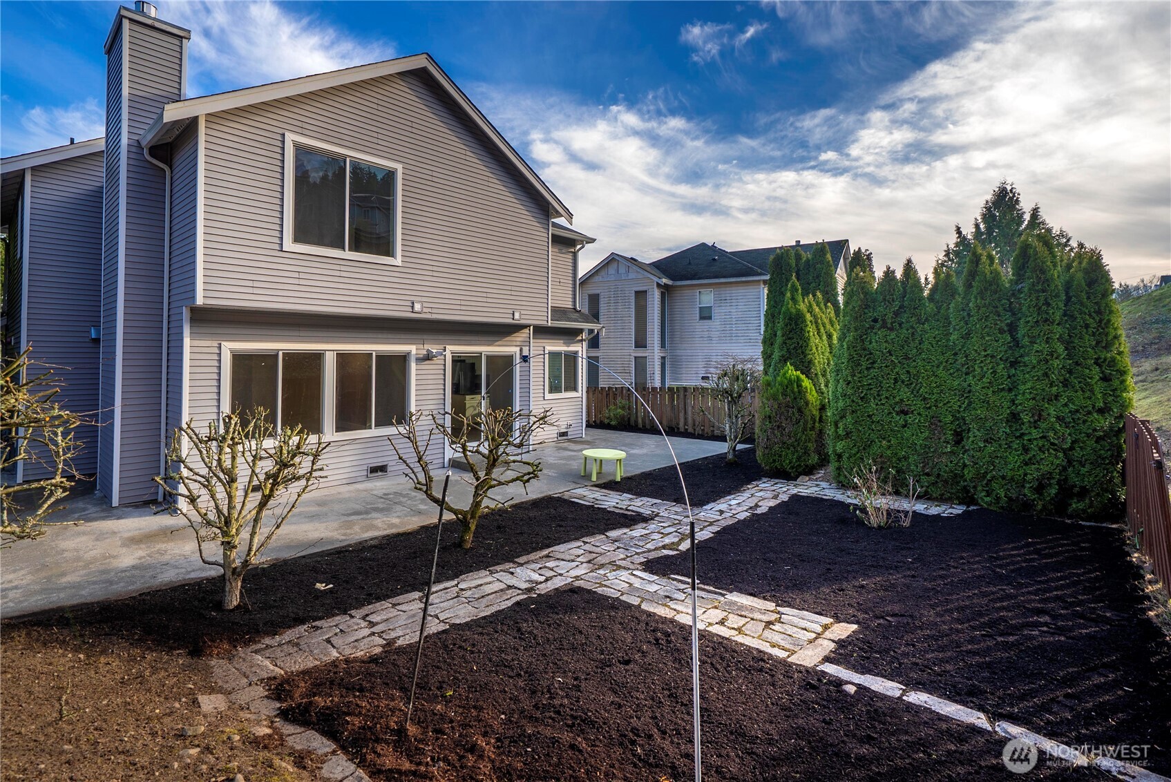 4125 South 220th Place, Unit 26 Kent, WA 98032 - Photo 39 of 39 a view of a house with backyard and sitting area