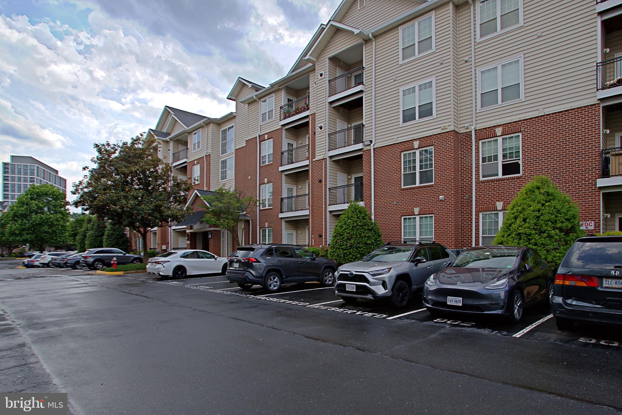 1570 Spring Gate Dr., Unit 7215 McLean, VA 22102 - Photo 1 of 30 a cars parked in front of a building