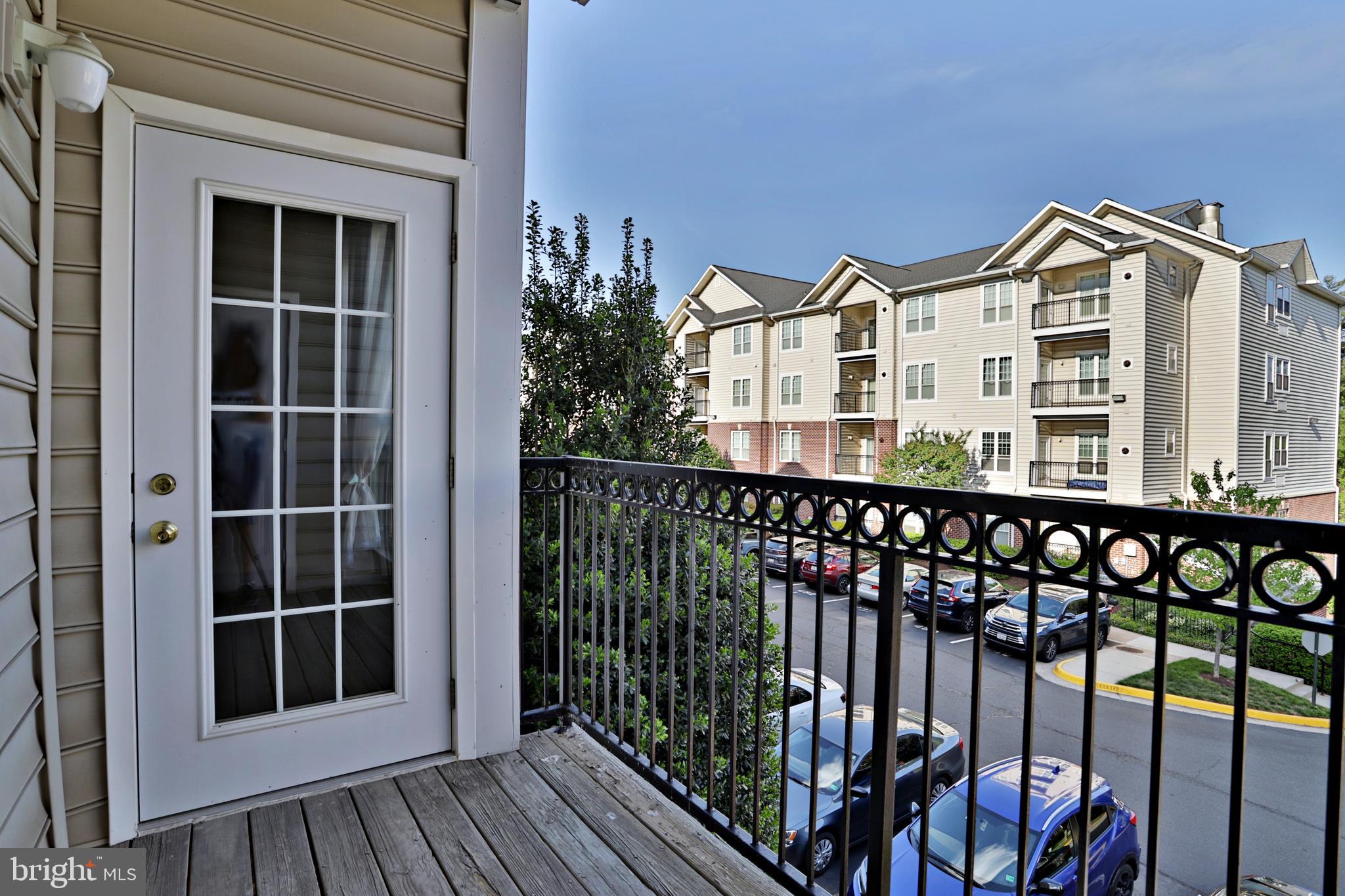 1570 Spring Gate Dr., Unit 7215 McLean, VA 22102 - Photo 15 of 30 a view of a large building from a balcony