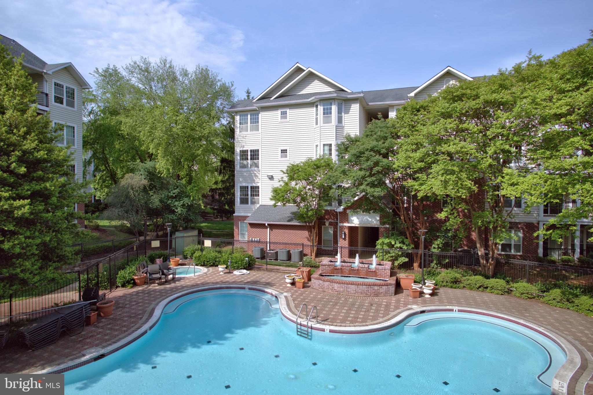 1570 Spring Gate Dr., Unit 7215 McLean, VA 22102 - Photo 18 of 30 a house view with a swimming pool and outdoor space