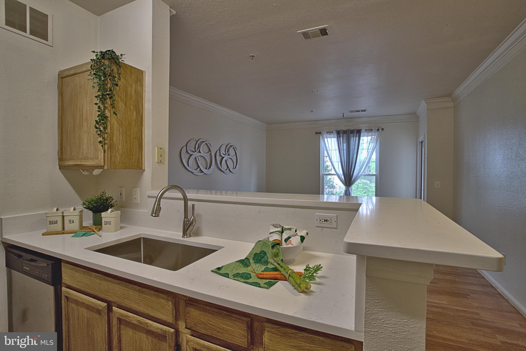 1570 Spring Gate Dr., Unit 7215 McLean, VA 22102 - Photo 3 of 30 a bathroom with a sink and a bathtub