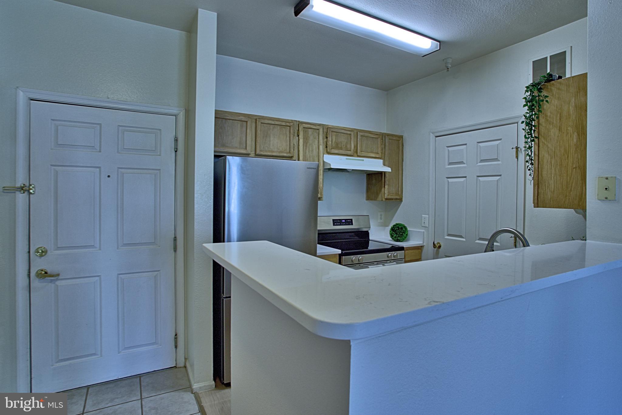 1570 Spring Gate Dr., Unit 7215 McLean, VA 22102 - Photo 6 of 30 a bathroom with a sink and a mirror