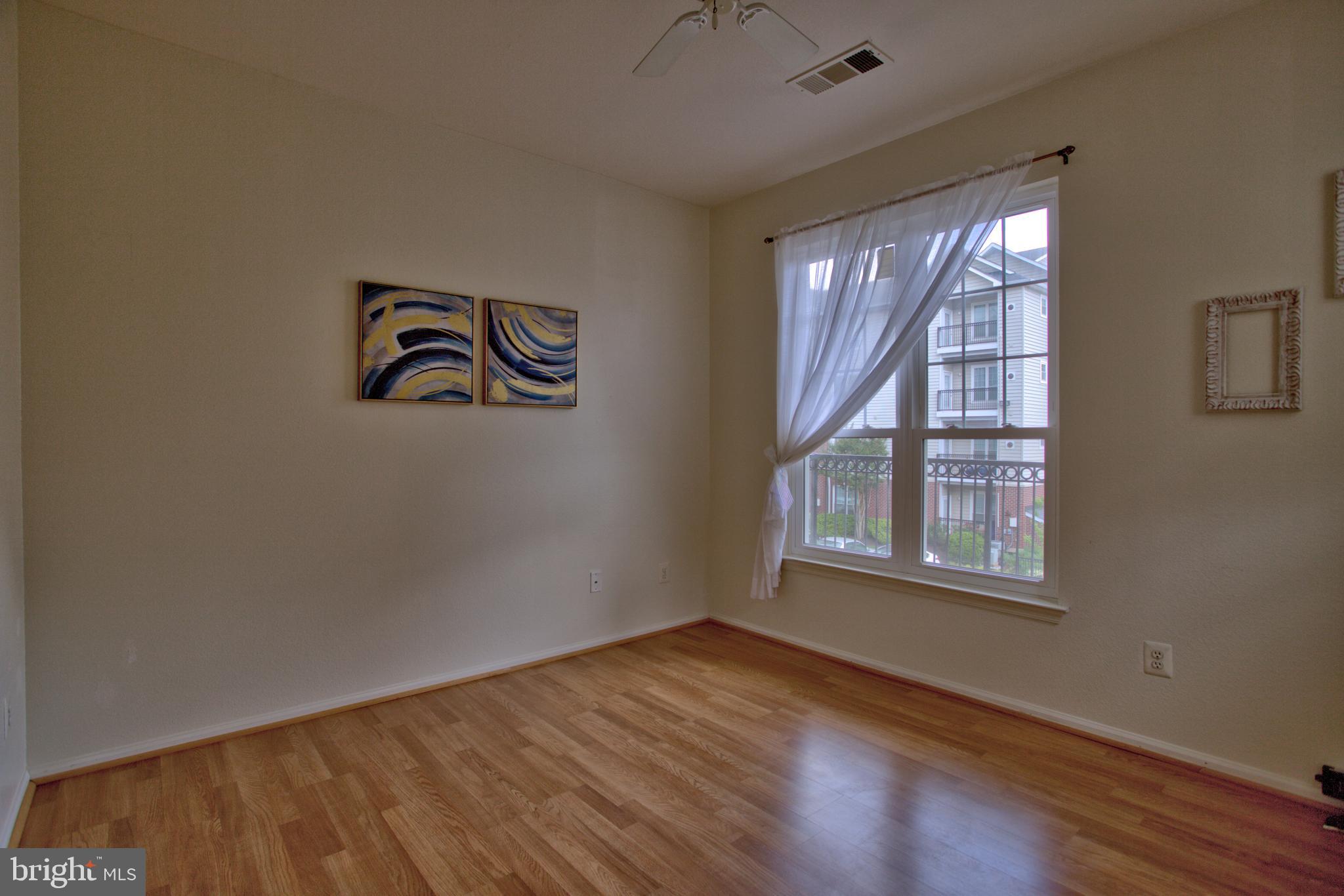 1570 Spring Gate Dr., Unit 7215 McLean, VA 22102 - Photo 9 of 30 an empty room with a window