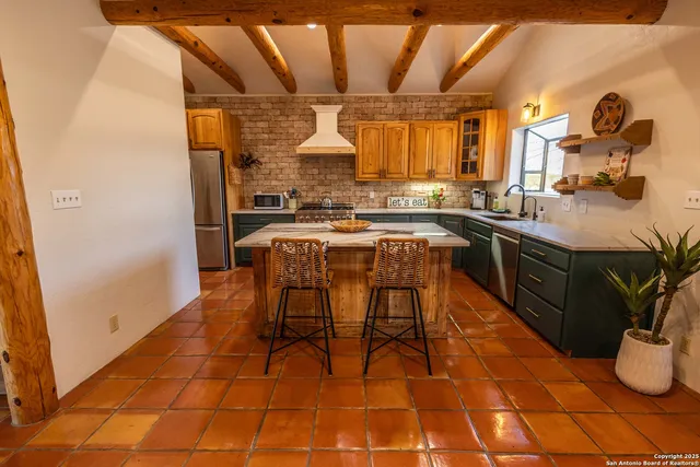 a dining table & chairs in a room