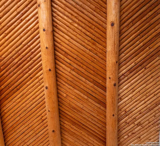 a view of a hallway and a livingroom with furniture