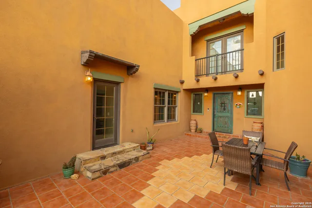 a backyard of a house with yard and seating space