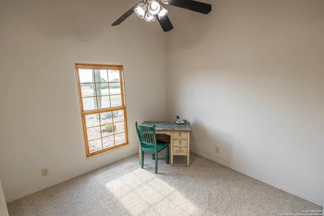 a view of a swimming pool with a lounge chair