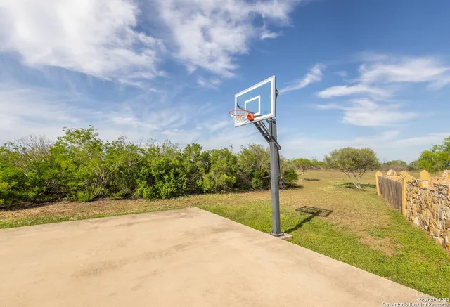 a bed room with a bed and a chandelier