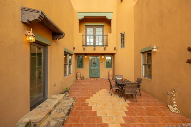 a view of a house with outdoor seating space