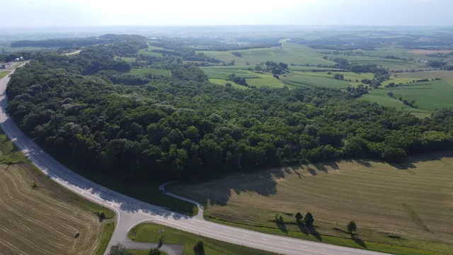 an aerial view of a house with a lake view