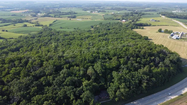 an aerial view of house with outdoor space and river
