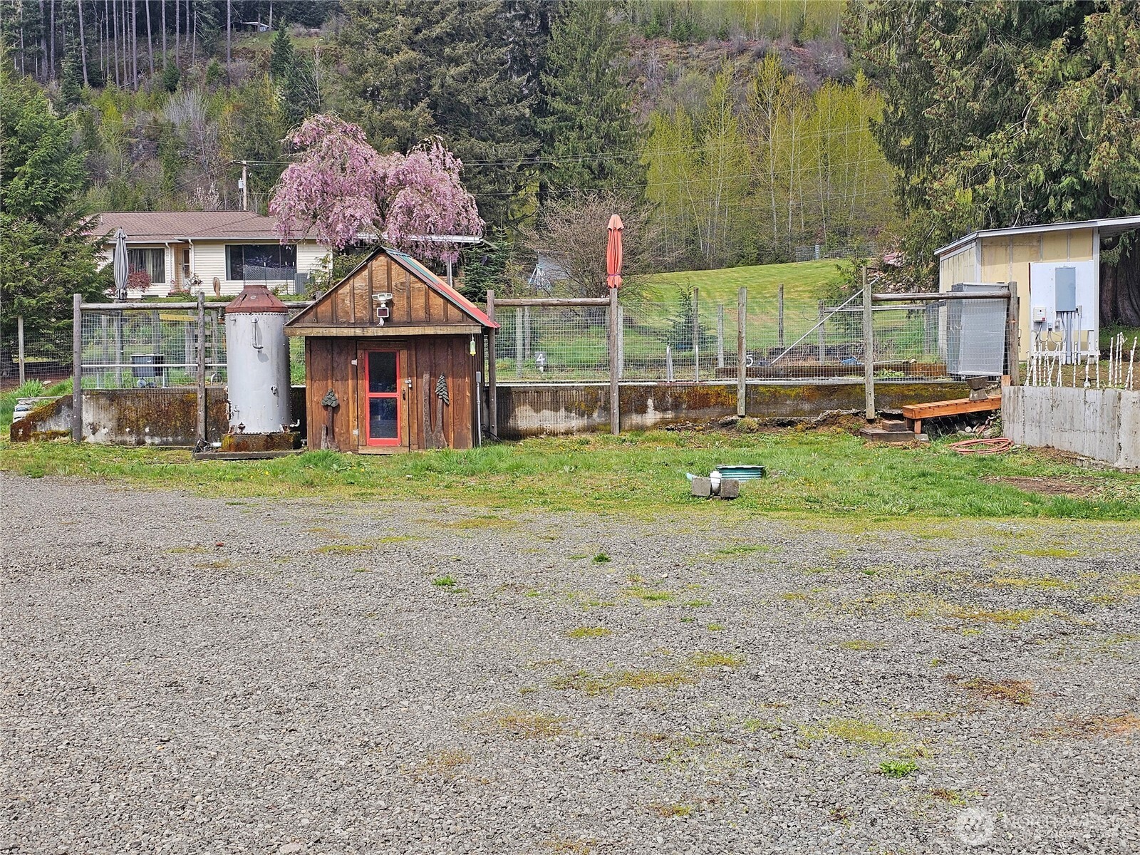 113 Leroy Road Randle, WA 98377 - Photo 30 of 40 a view of a house with a yard and sitting area