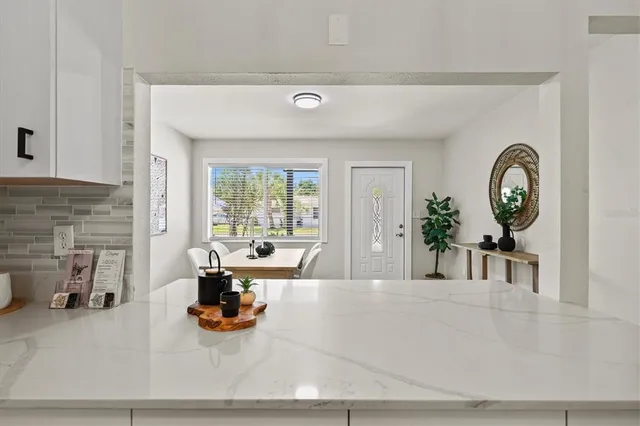 a kitchen with sink stove and cabinets