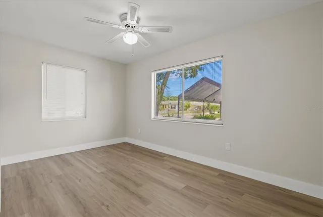 a patio with a table and chairs