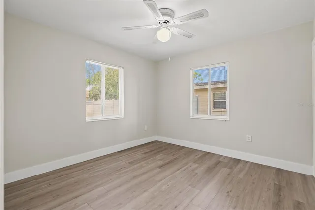 a view of a house with a yard porch and sitting area