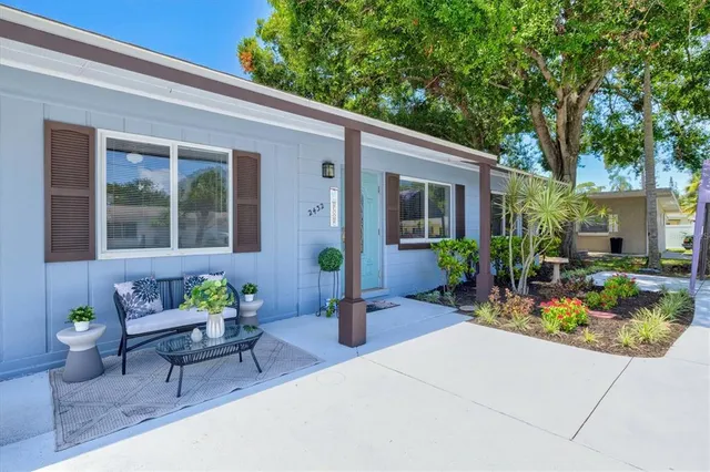 a front view of a house with garden