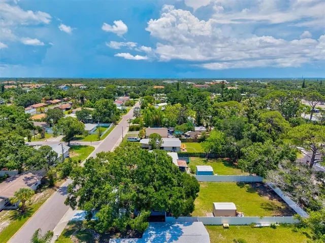 a view of a lake with a house swimming pool and outdoor space