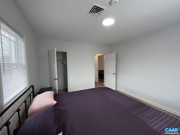 a furnished livingroom with a window
