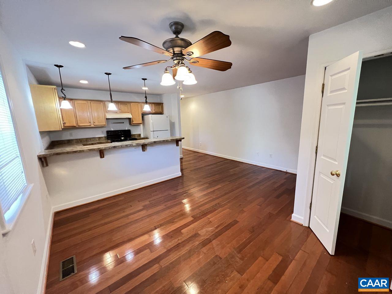 301 7th Street Southwest Charlottesville, VA 22903 - Photo 4 of 16 a view of kitchen with cabinets appliances and wooden floor