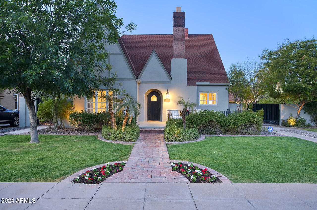 a front view of a house with garden