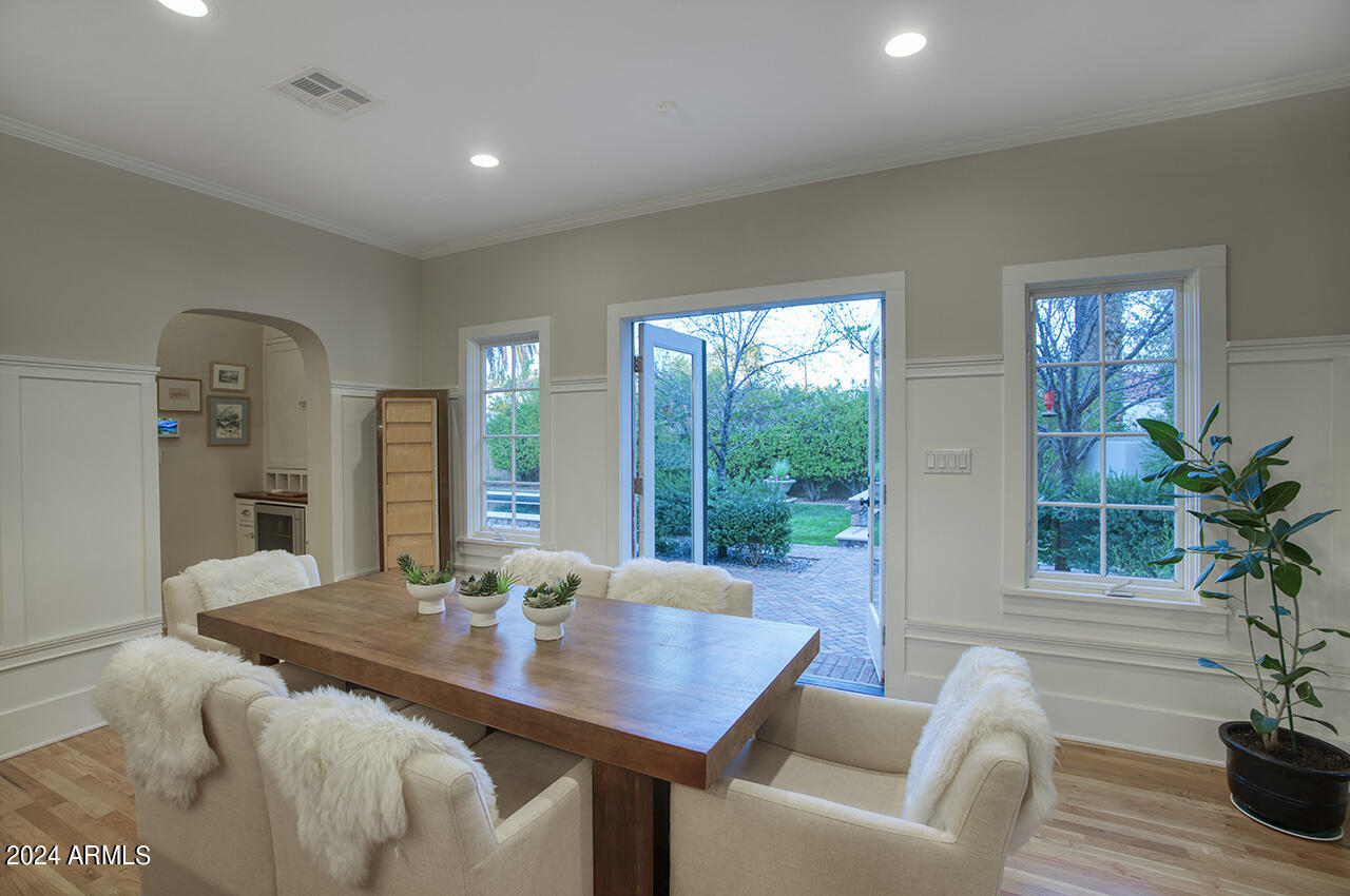 324 West Monte Vista Road Phoenix, AZ 85003 - Photo 11 of 39 a view of a dining room with furniture window and wooden floor