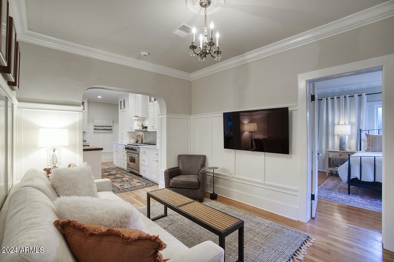 324 West Monte Vista Road Phoenix, AZ 85003 - Photo 18 of 39 a living room with furniture and a flat screen tv