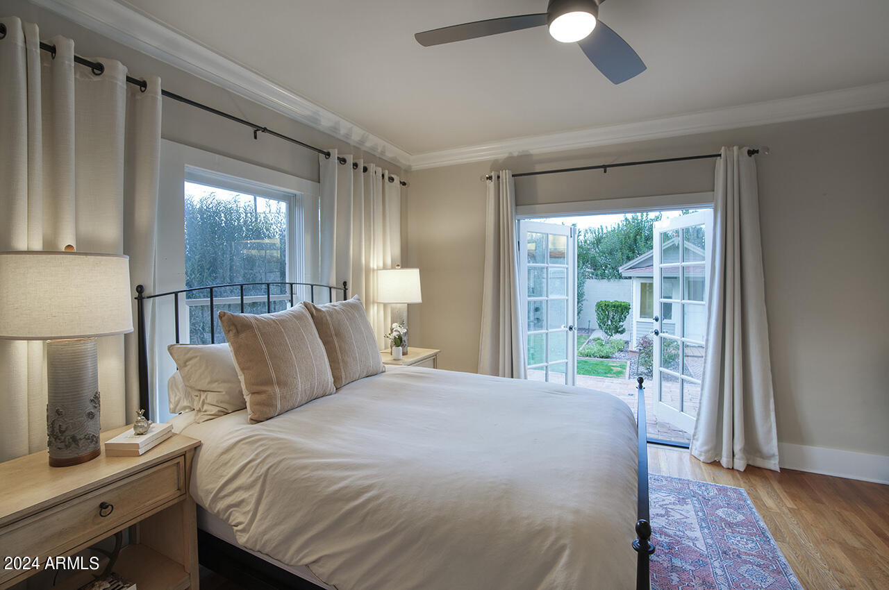 324 West Monte Vista Road Phoenix, AZ 85003 - Photo 19 of 39 a bedroom with a large bed and a large window