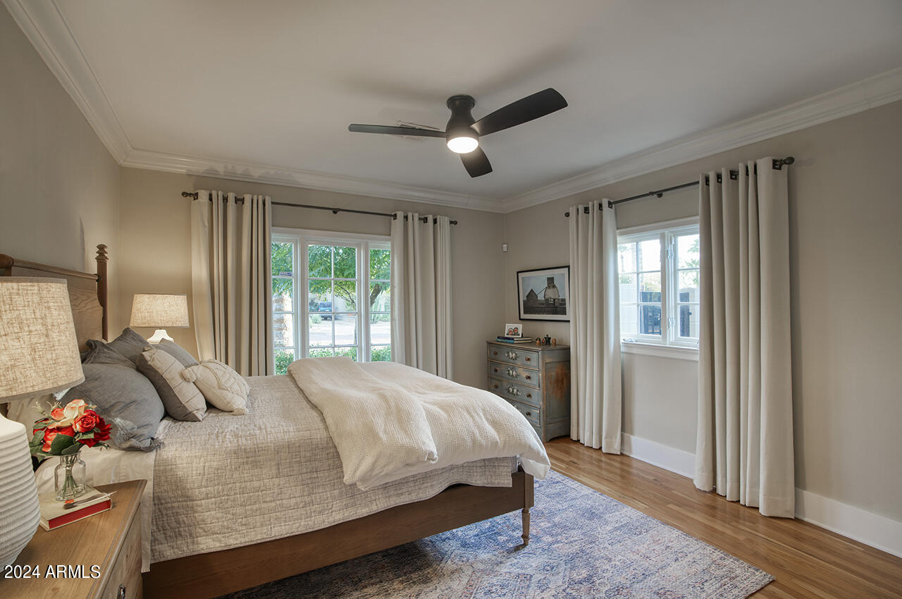 324 West Monte Vista Road Phoenix, AZ 85003 - Photo 22 of 39 a bedroom with a bed closet and a window