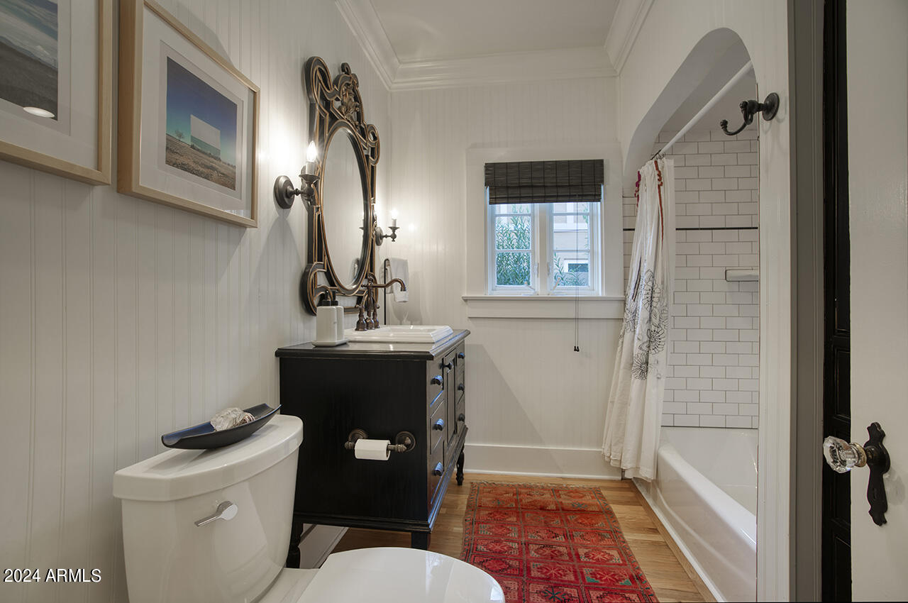 324 West Monte Vista Road Phoenix, AZ 85003 - Photo 24 of 39 a bathroom with a sink a toilet a mirror and shower