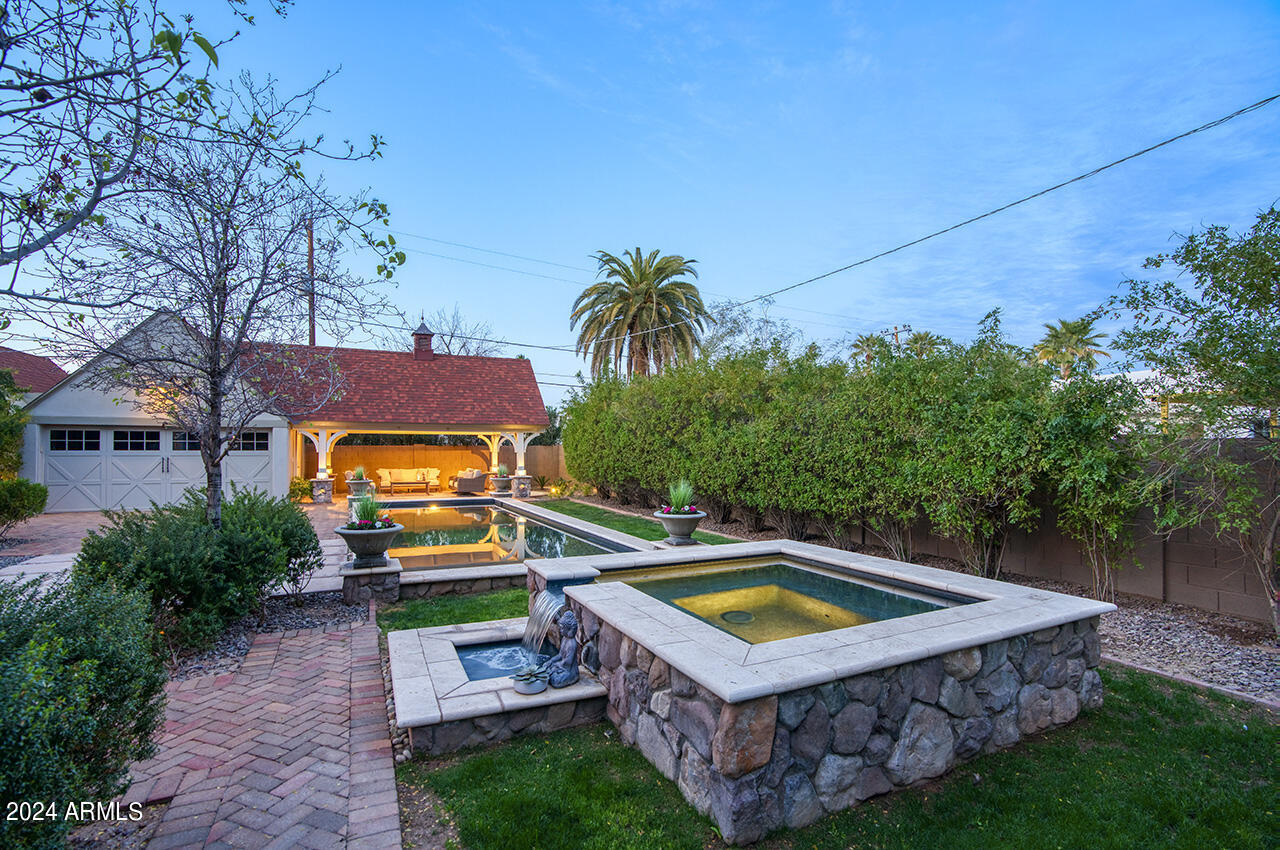 324 West Monte Vista Road Phoenix, AZ 85003 - Photo 30 of 39 a view of a house with a yard and furniture