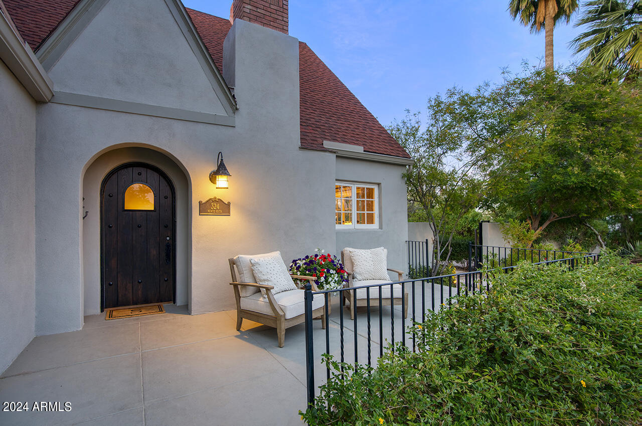 324 West Monte Vista Road Phoenix, AZ 85003 - Photo 4 of 39 a view of a patio with table and chairs and potted plants