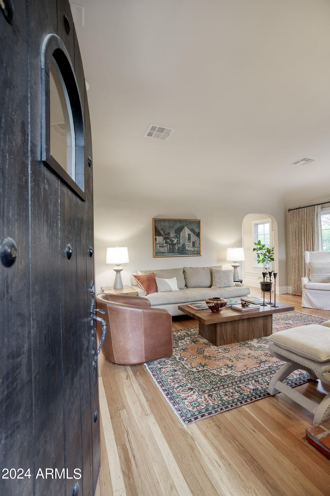 324 West Monte Vista Road Phoenix, AZ 85003 - Photo 5 of 39 a living room with furniture and a wooden floor