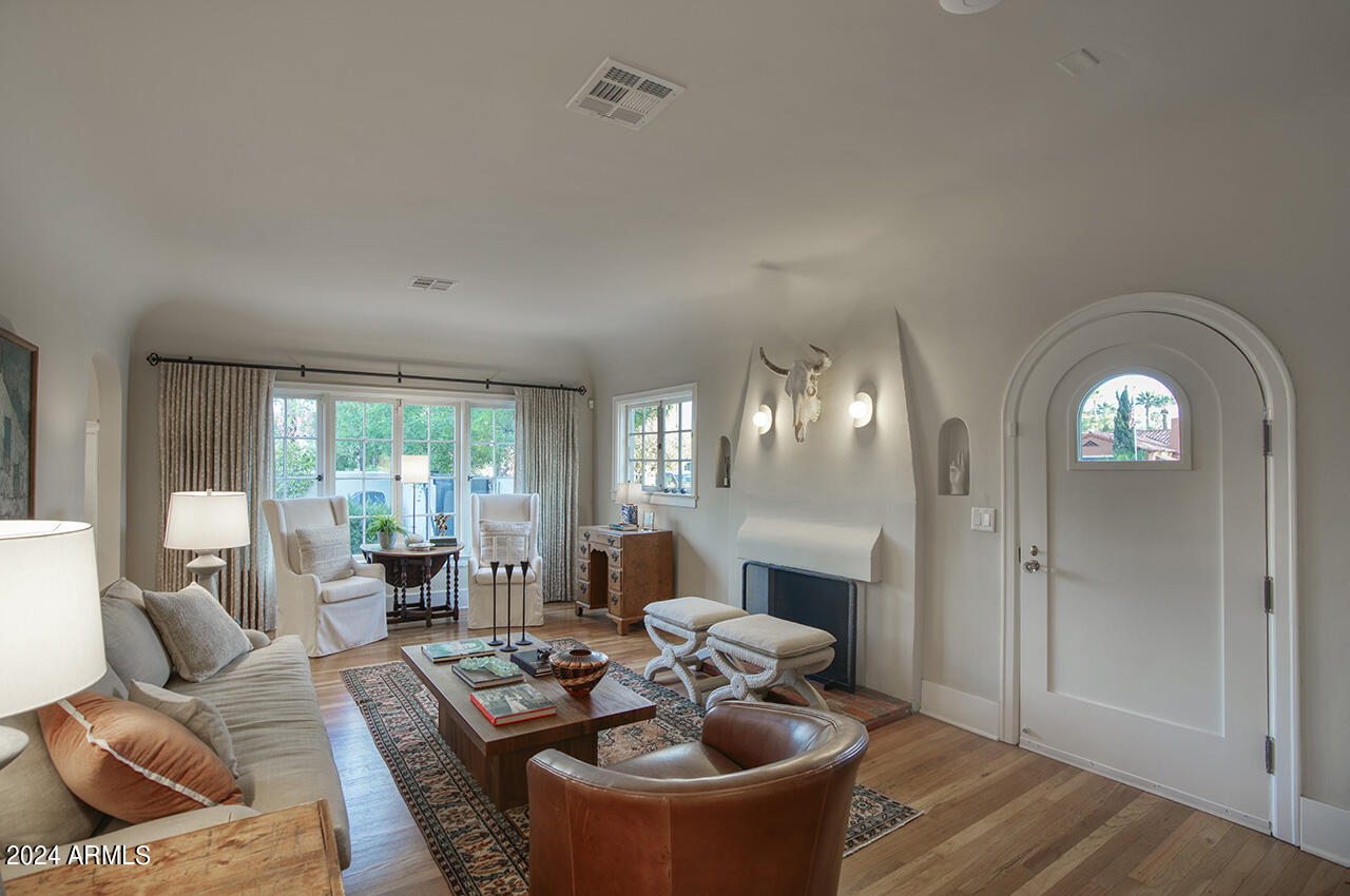 324 West Monte Vista Road Phoenix, AZ 85003 - Photo 7 of 39 a living room with furniture and a fireplace
