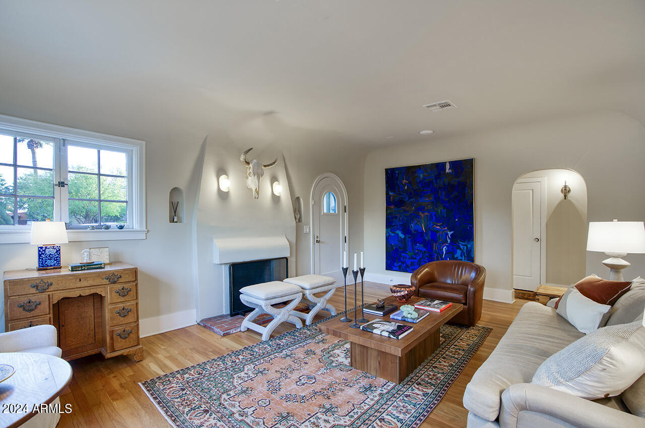 324 West Monte Vista Road Phoenix, AZ 85003 - Photo 8 of 39 a living room with furniture and a fireplace