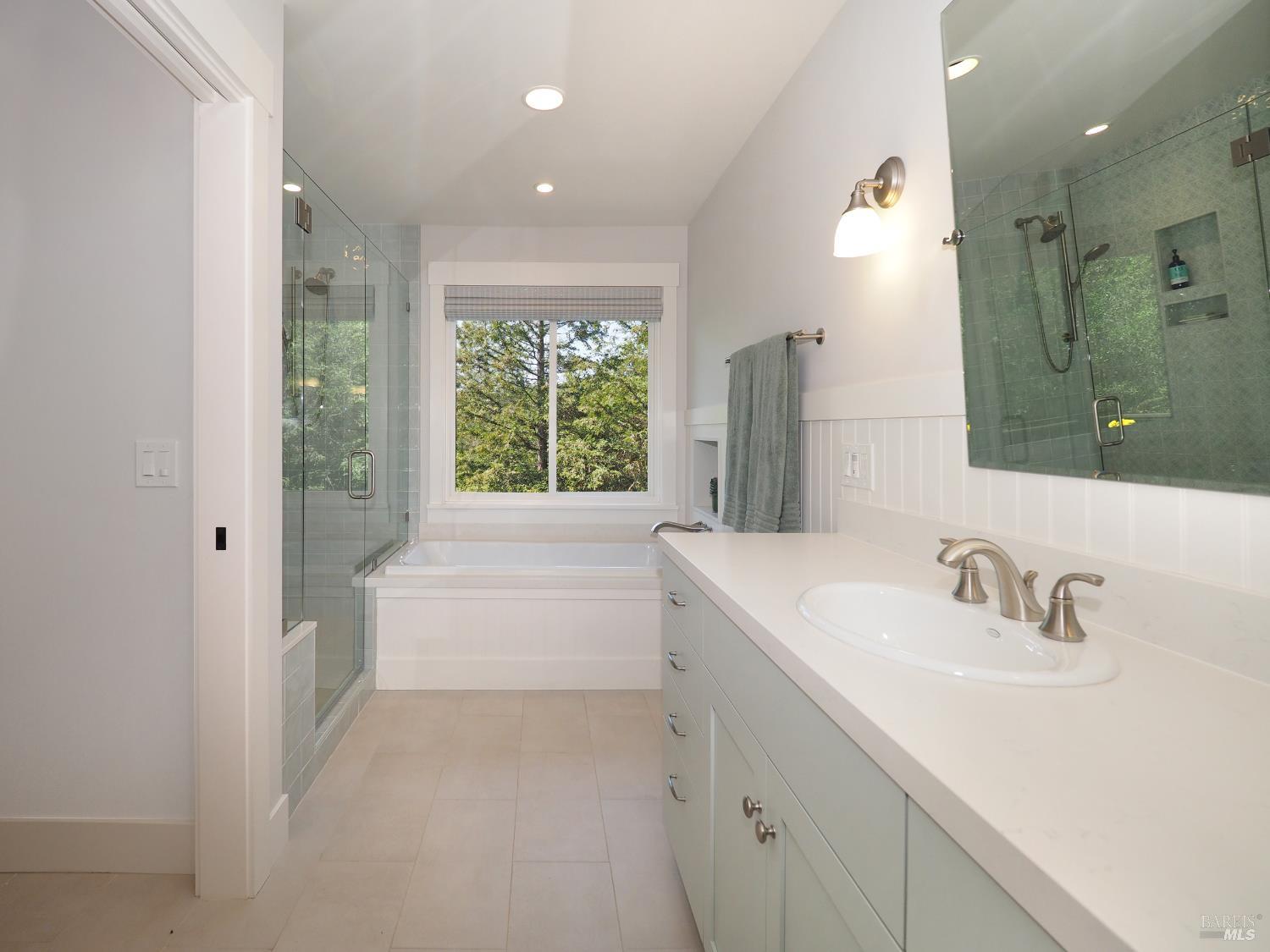 1575 Fox Ridge Road Geyserville, CA 95441 - Photo 26 of 57 Luxurious bathroom with soaking tub and picture window.