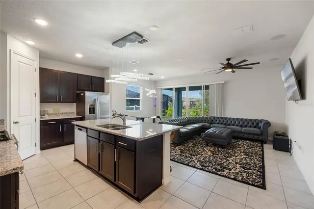 a kitchen with stainless steel appliances granite countertop a stove and a sink