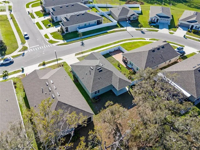 an aerial view of a house with a swimming pool