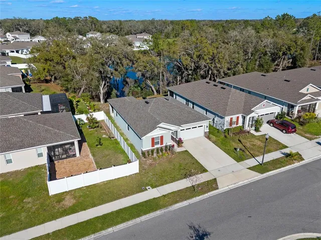 an aerial view of a house with a garden