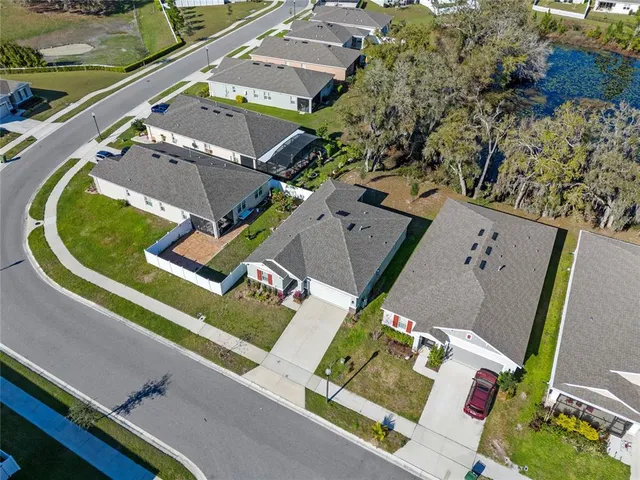 an aerial view of a house with a swimming pool