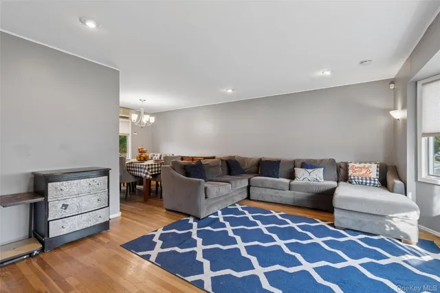 a living room with furniture and a rug
