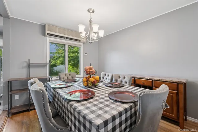 a view of a dining room with furniture window and outside view