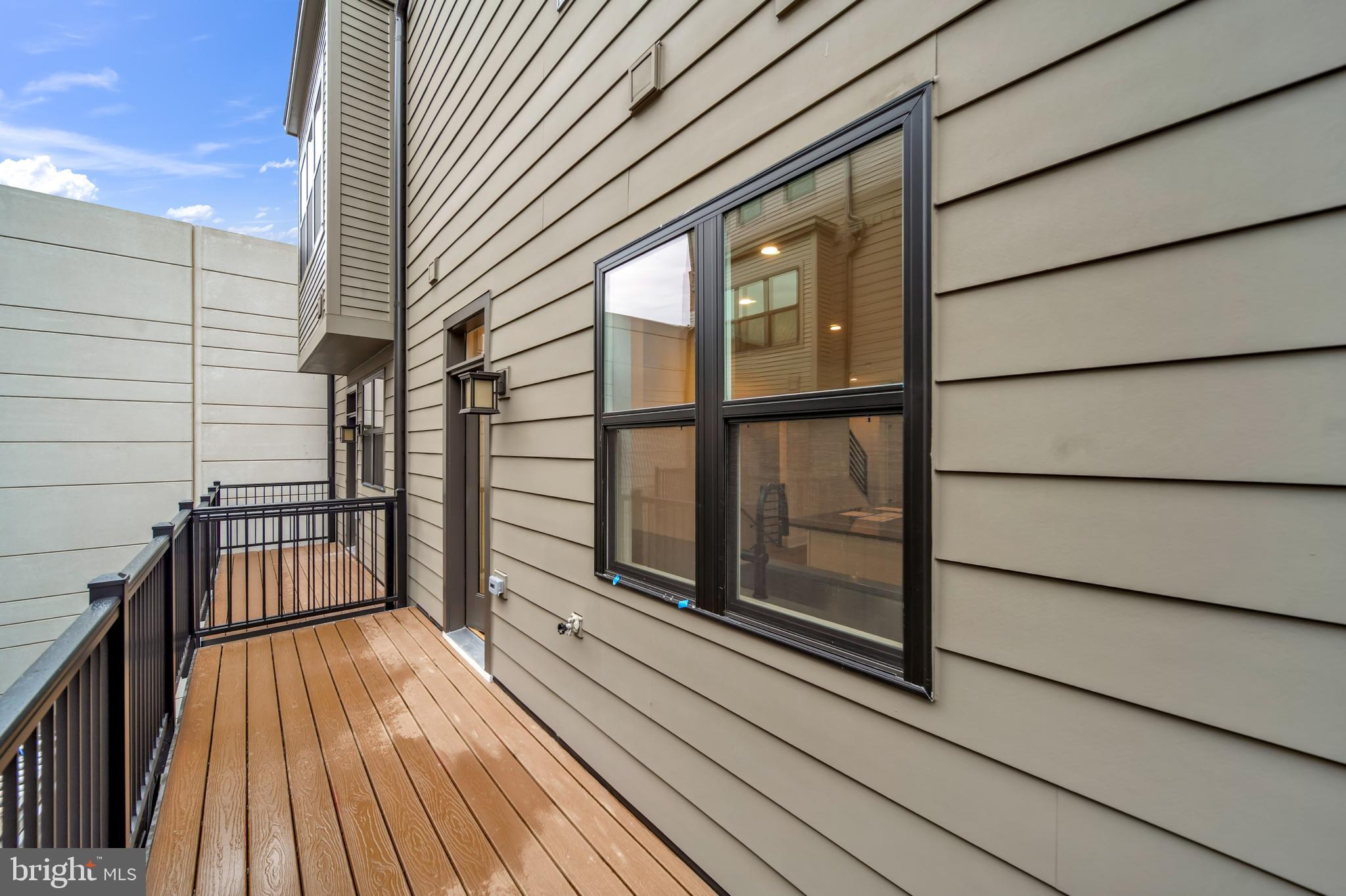 5420 Goshawk Alley Bethesda, MD 20816 - Photo 13 of 57 a view of balcony with wooden floor